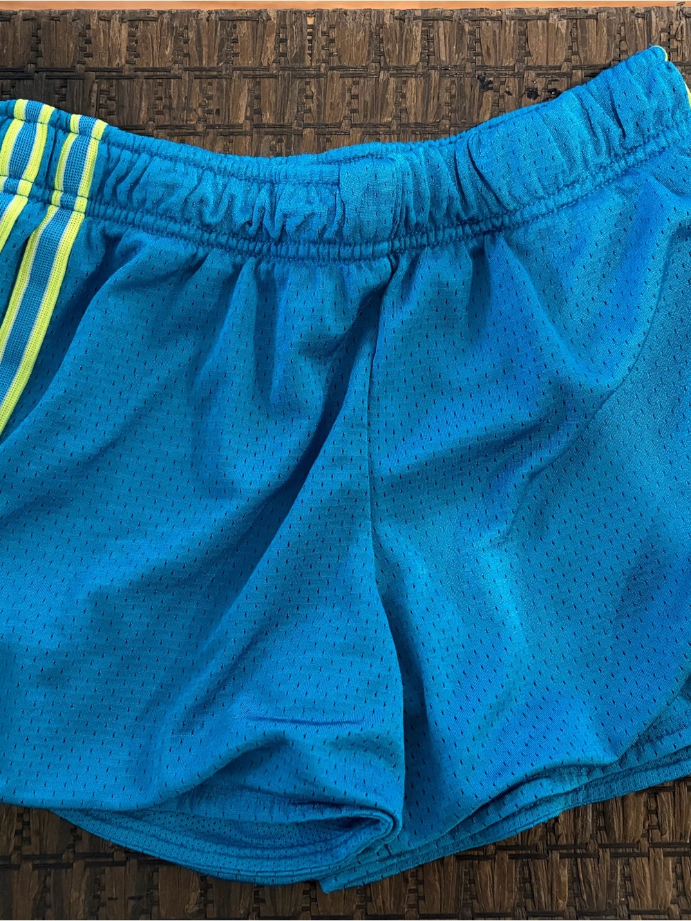 Nike Kids Blue Athletic Shorts with Neon Yellow Stripe